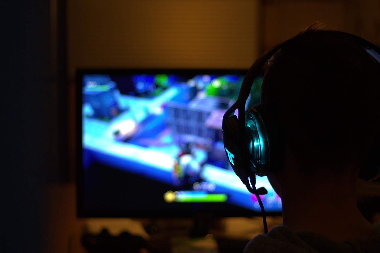 Behind-the-scenes view of streamer switching between camera angles on OBS, monit